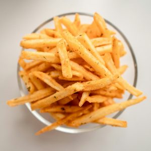 Suya-dust fries served in a paper cone