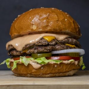 Grilled chicken burger with spicy pepper sauce