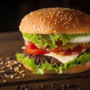 Suya smash burger with melted cheese and pepper aioli, close up